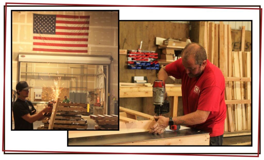 Two men working in a woodshop: one uses a power tool on a wooden plank while the other works with metal, creating sparks. An American flag hangs above wooden pallets in the background, highlighting skilled hands building for the economy.